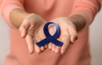 woman holding a ribbon