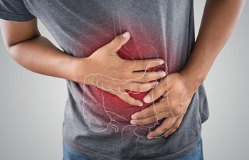 man holding his stomach in pain