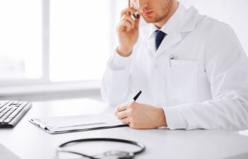 Doctor Discussing Test Results with Patient on the Phone