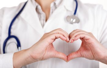 Doctor Showing Heart Sign With Their Hands